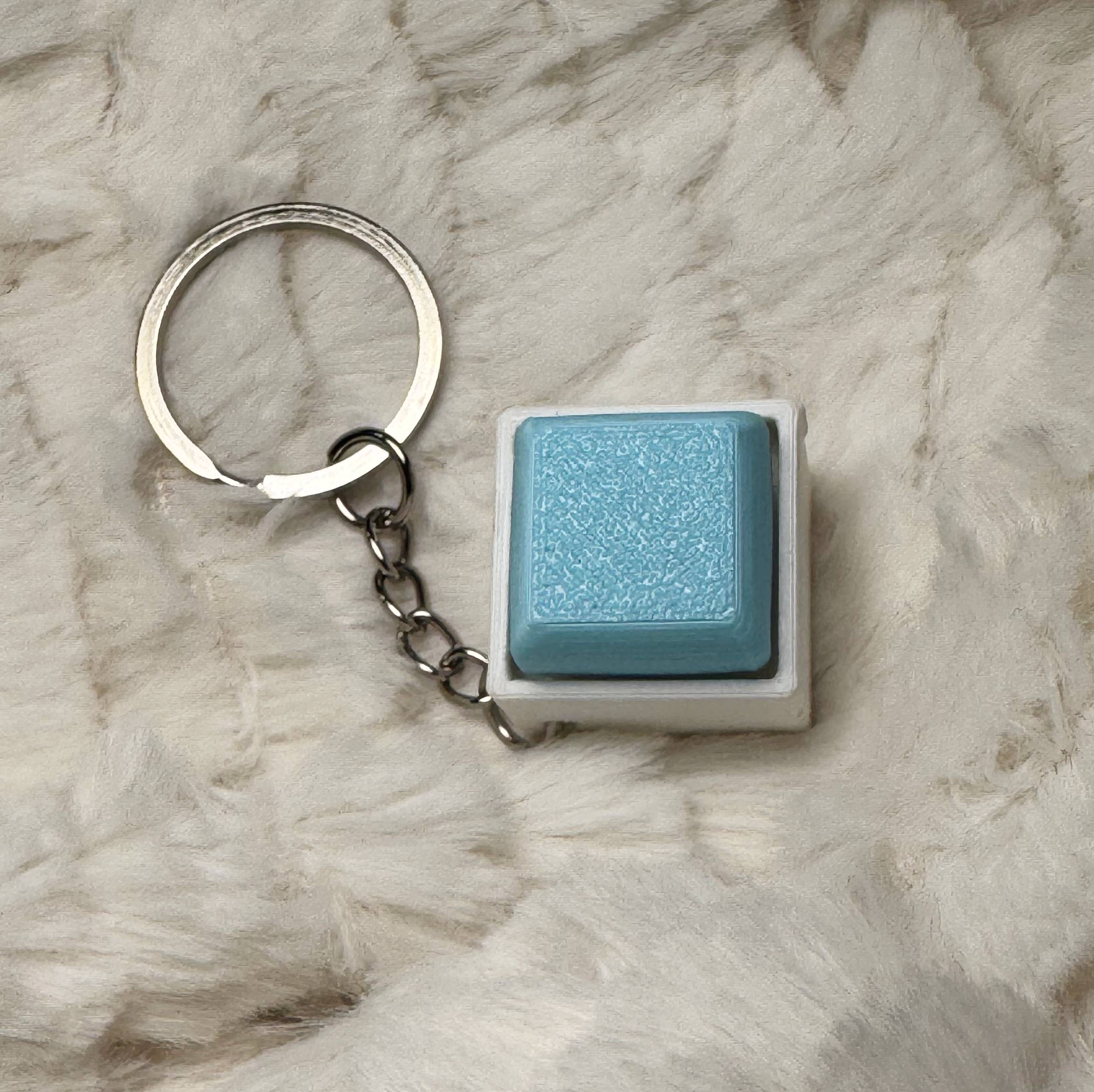 1x1 3D Printed Fidget Clicker Keyring White Base – Mechanical Keyboard Style Stress Toy ASMR - Baby Blue